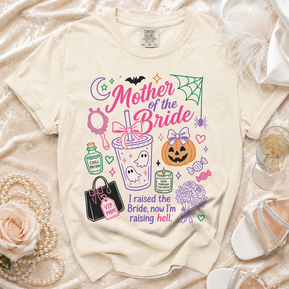 Cream t-shirt with "Mother of the Bride" Halloween-themed graphic and text.