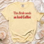 Yellow t-shirt with red text reading "This Bride needs an Iced Coffee".