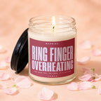 Candle with text "Ring Finger Overheating" and "She said yes. Oh look, it's on fire."