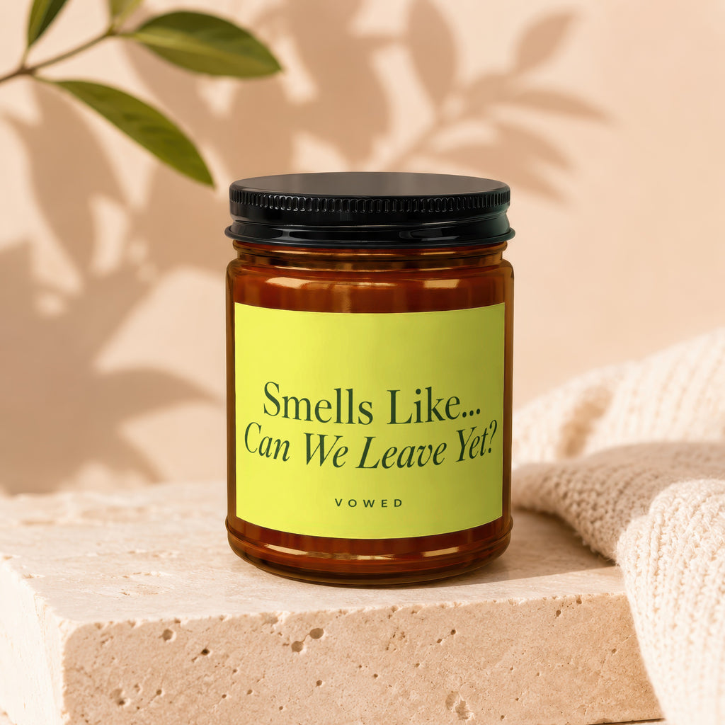 Amber candle in jar with black lid and lime green label reading "Smells Like...Can We Leave Yet?".