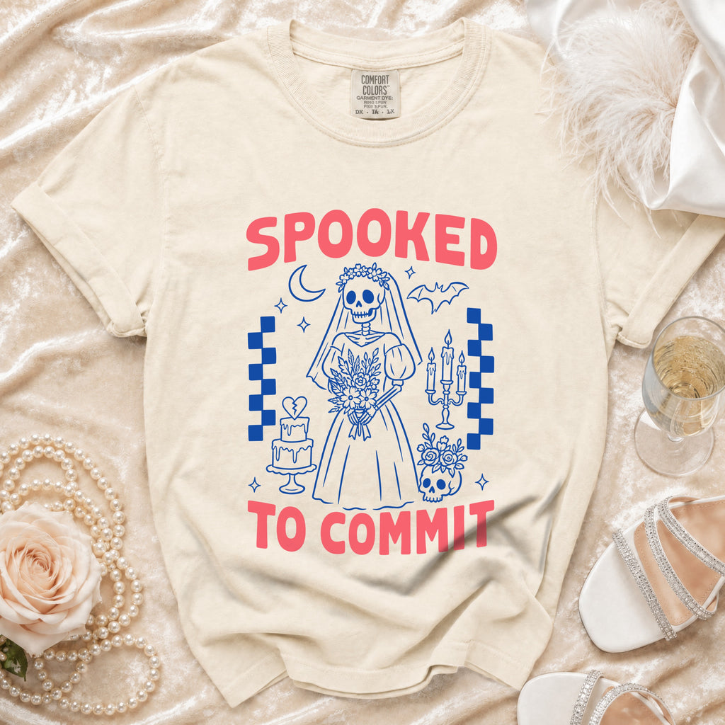 Cream t-shirt with "Spooked to Commit" and skeleton bride graphic.