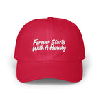 A bright red baseball cap embroidered with the white text Forever Starts With A Howdy.