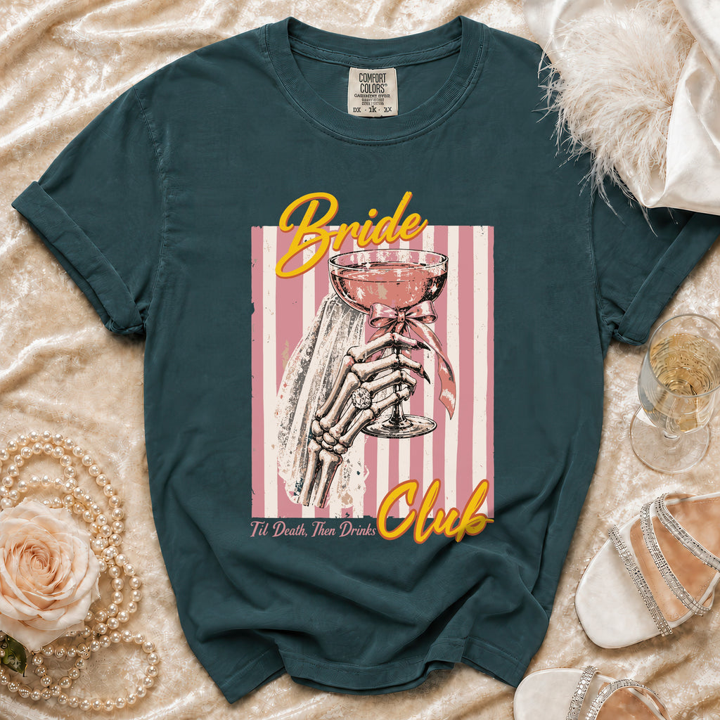Dark teal t-shirt with "Bride Club" text and skeleton holding a drink graphic.