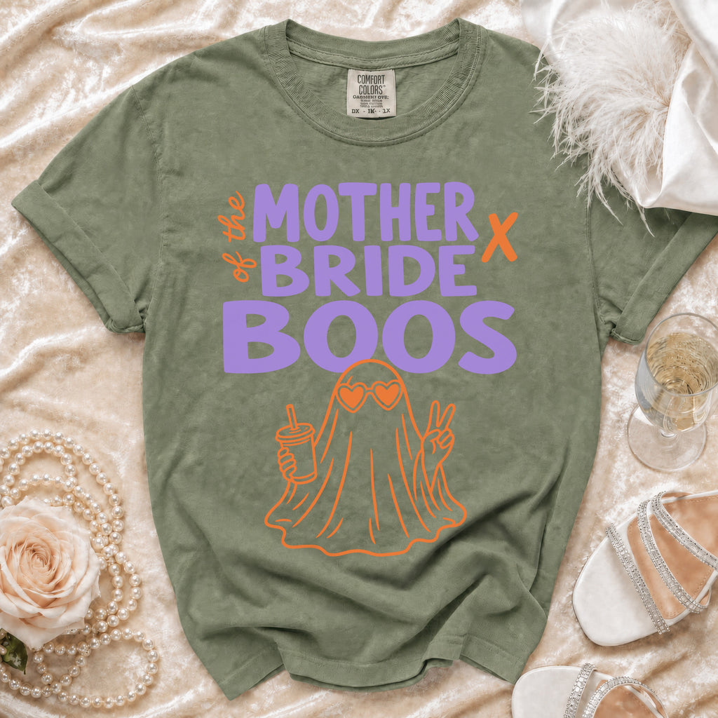 Green t-shirt with "the mother bride boos" text and orange ghost graphic.