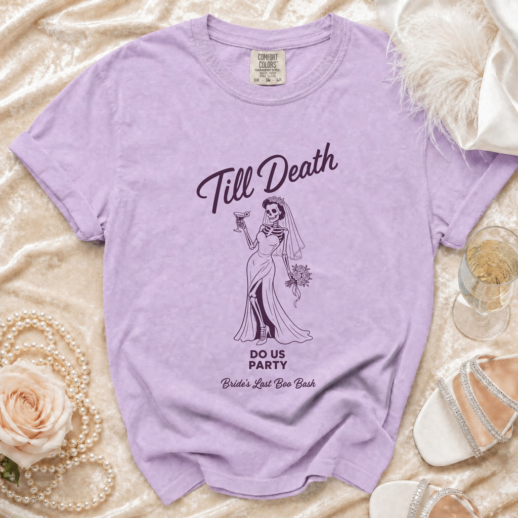 Lilac t-shirt with skeleton bride graphic: "Till Death Do Us Party Bride's Last Boo Bash".
