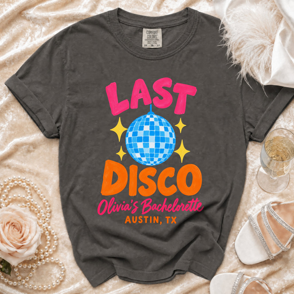 Charcoal gray crewneck t-shirt with pink and orange graphic text reading Last Disco Olivia's Bachelorette Austin, TX.