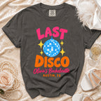 Charcoal gray crewneck t-shirt with pink and orange graphic text reading Last Disco Olivia's Bachelorette Austin, TX.