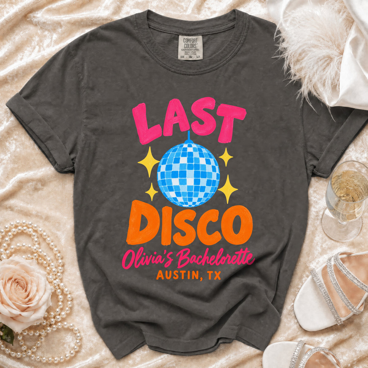 Charcoal gray crewneck t-shirt with pink and orange graphic text reading Last Disco Olivia's Bachelorette Austin, TX.