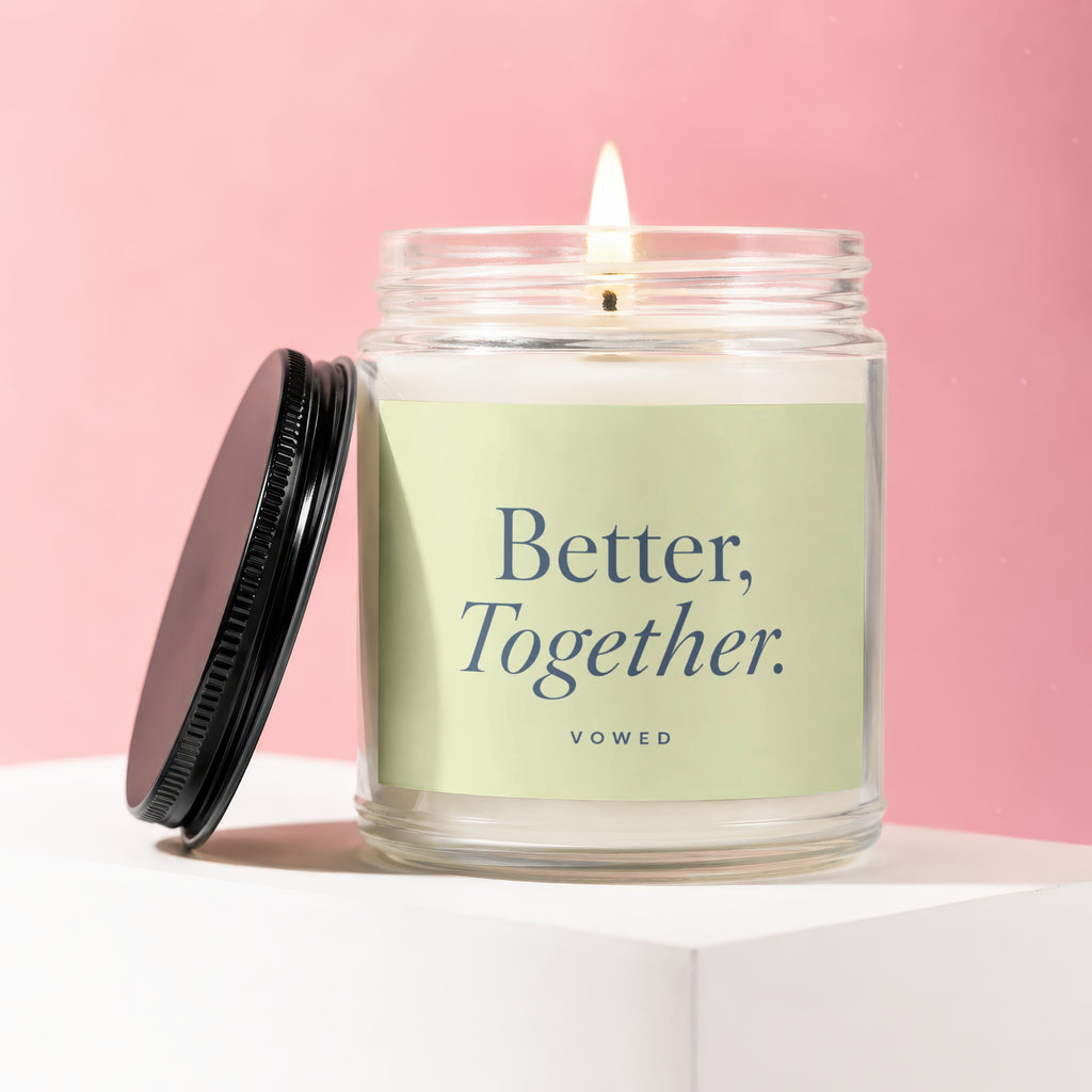 Jar candle with lit wick and "Better, Together." text on a light green label.