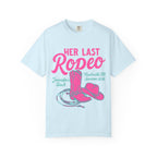 Light blue t-shirt with "Her Last Rodeo" text, cowboy boots, hat, and lasso graphic.