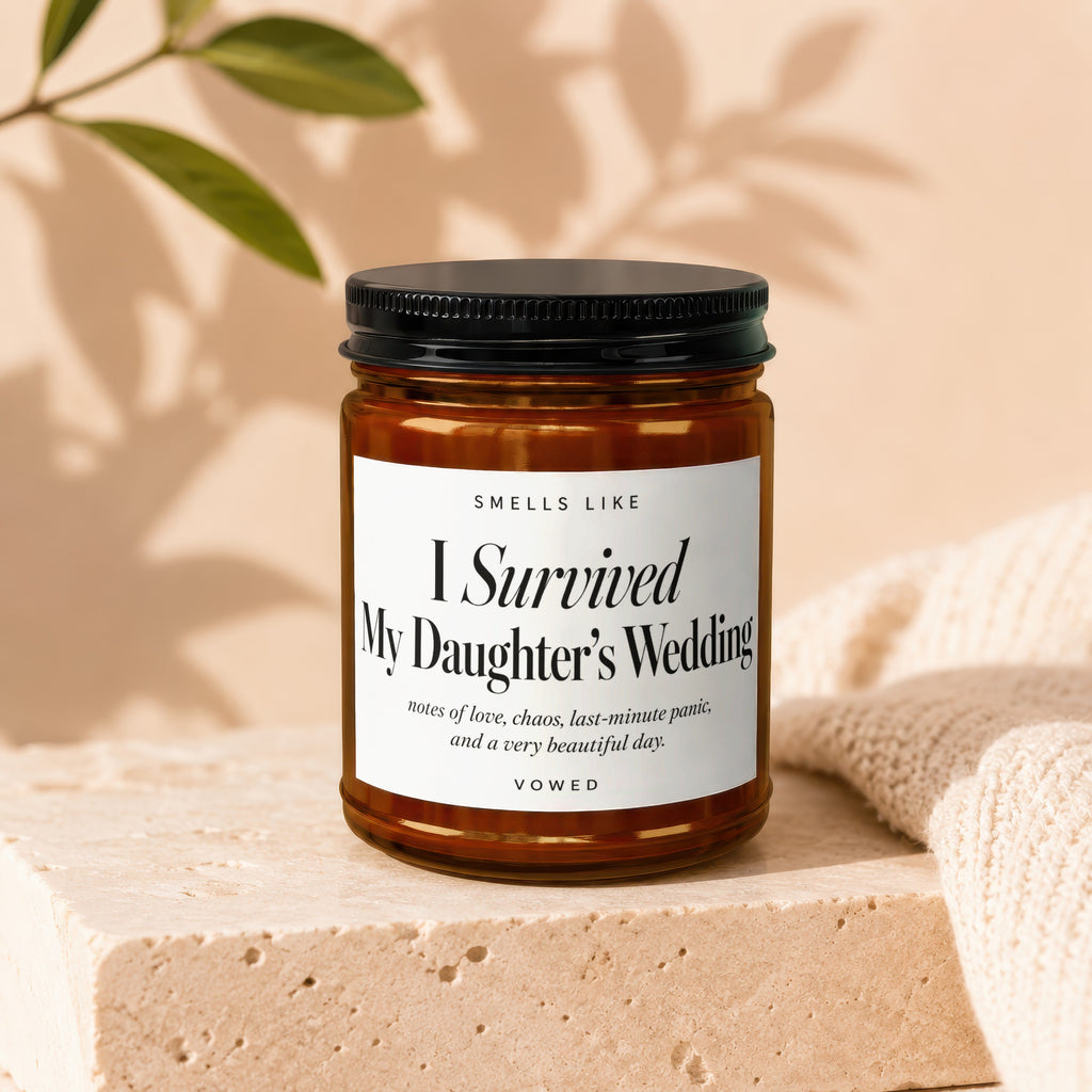 Candle labeled "I Survived My Daughter's Wedding" with poetic description.