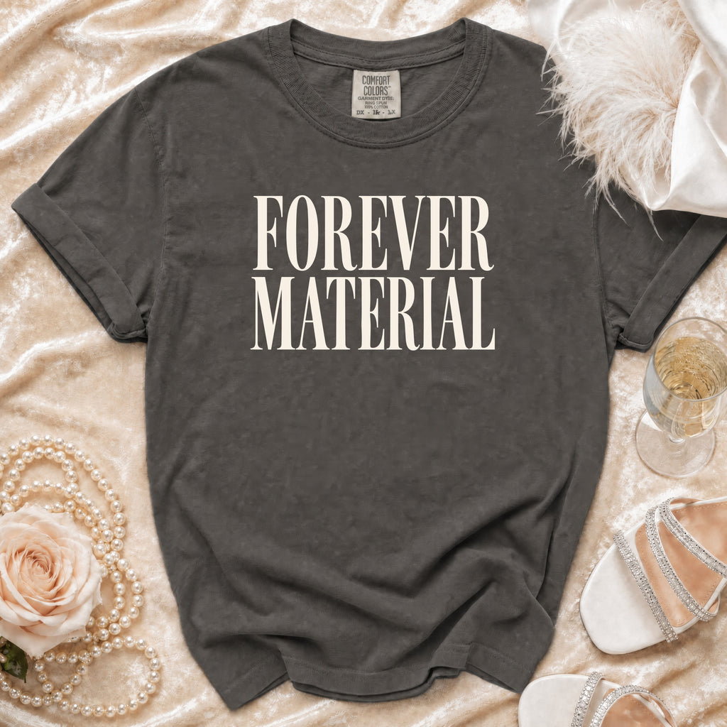 Charcoal grey Comfort Colors t-shirt with "FOREVER MATERIAL" text.