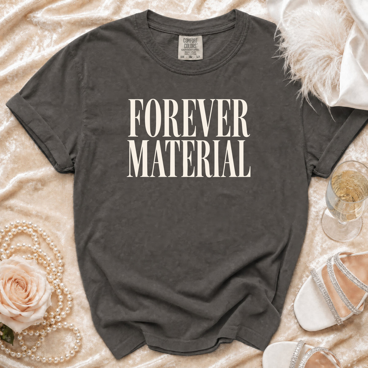 Charcoal grey Comfort Colors t-shirt with "FOREVER MATERIAL" text.
