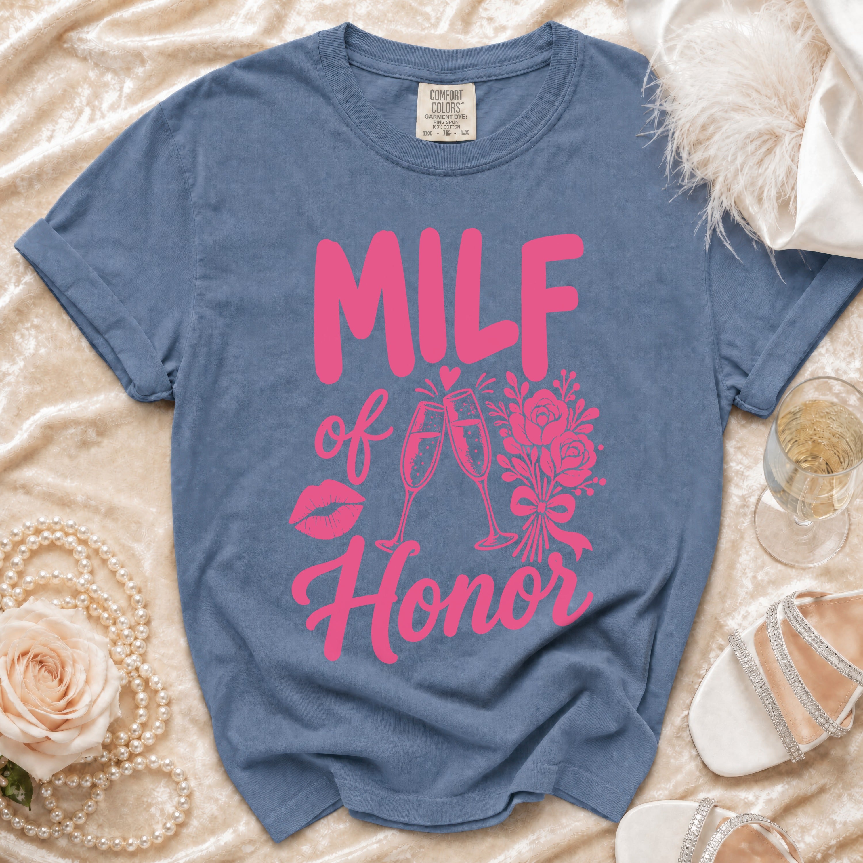 Blue t-shirt with pink "MILF of Honor" text, lips, and champagne glasses.