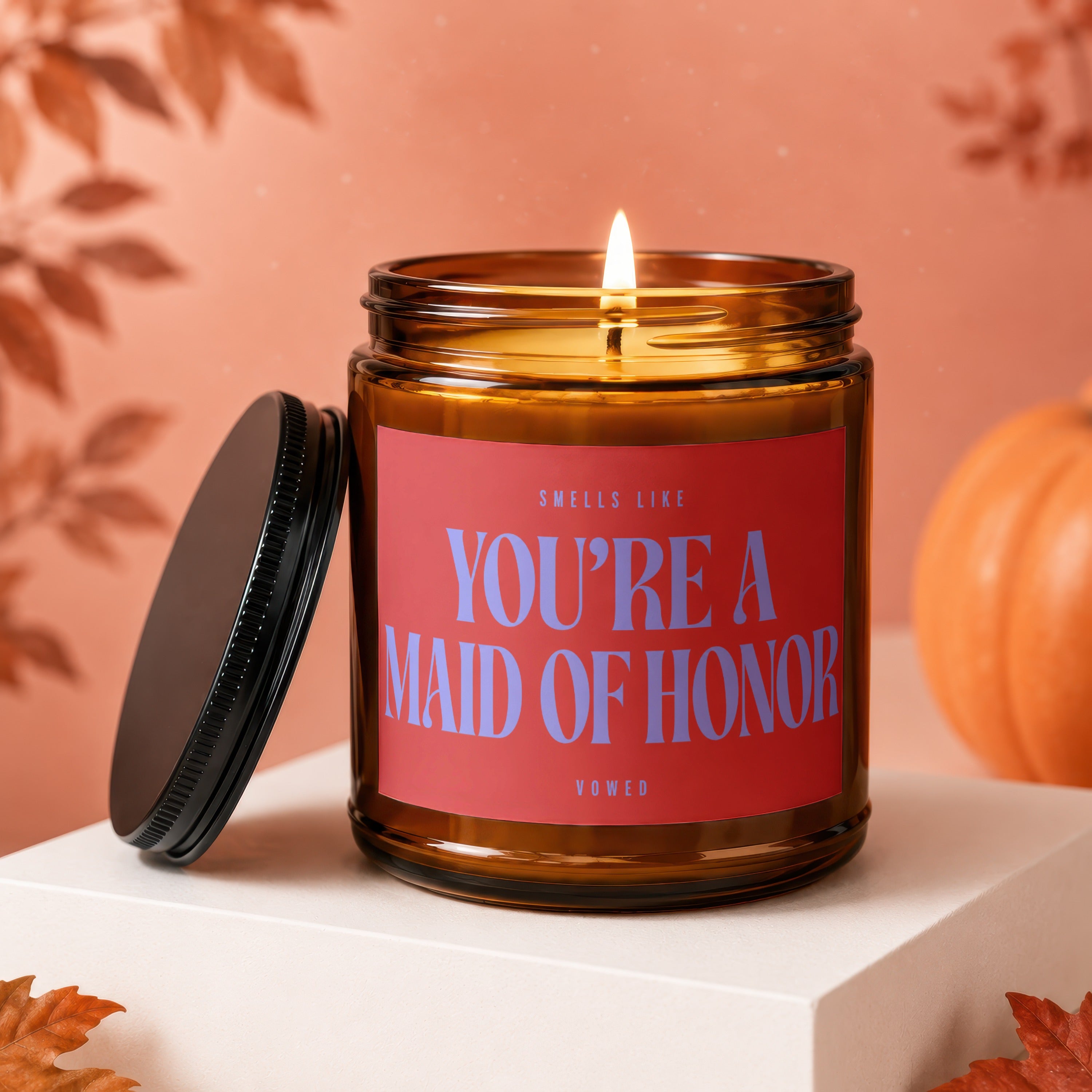Amber jar candle with lit flame, "You're a Maid of Honor" text.