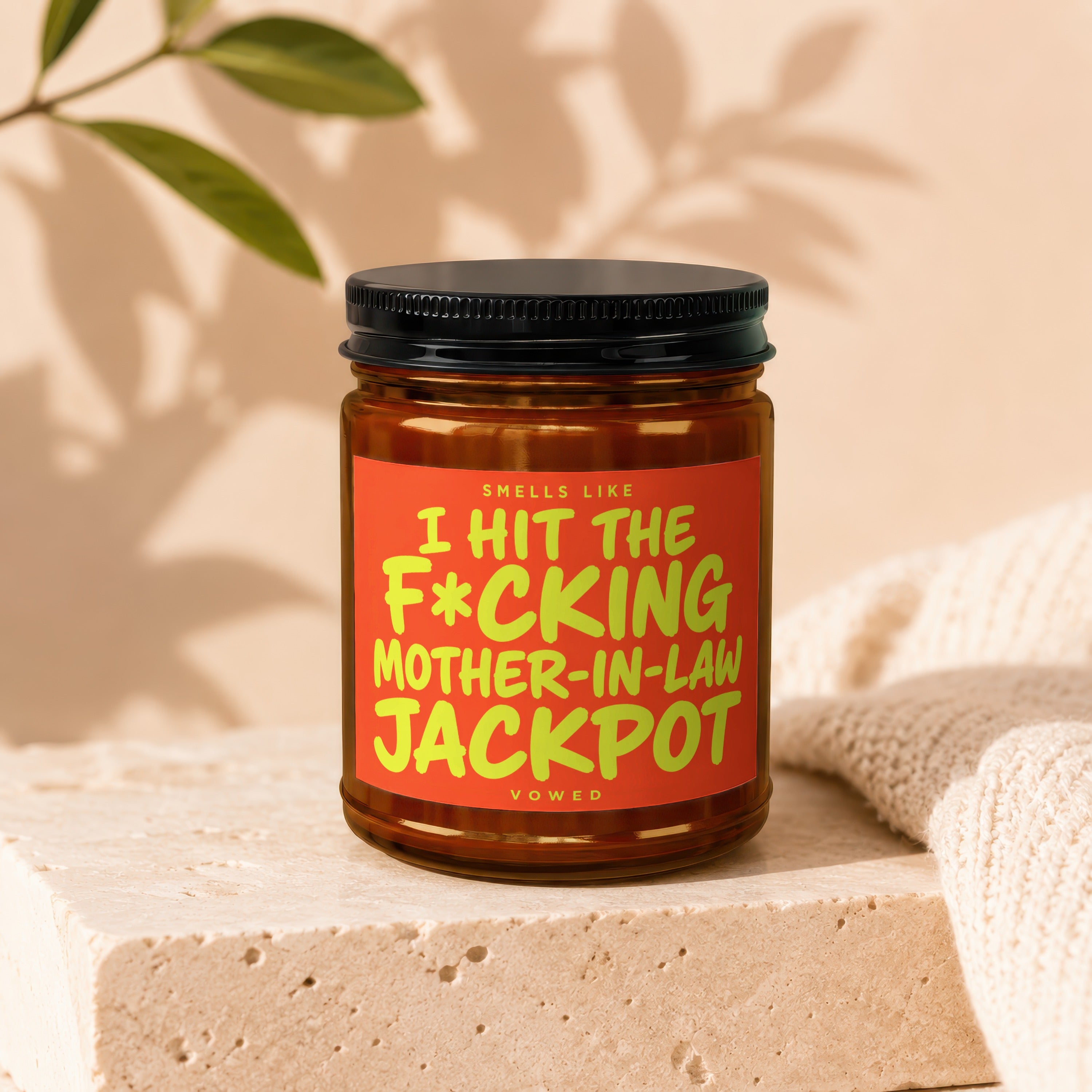 Jar with label reading "Smells Like I Hit The F*cking Mother-In-Law Jackpot".