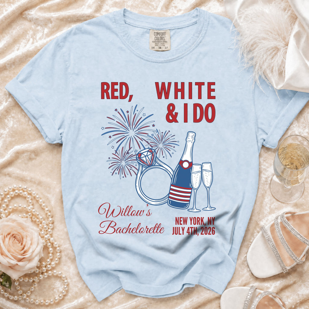 Light blue t-shirt for "Willow's Bachelorette" party with fireworks, rings, and champagne glasses.