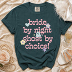 Dark teal t-shirt with pink text "bride by night ghost by choice!" and cute graphics.