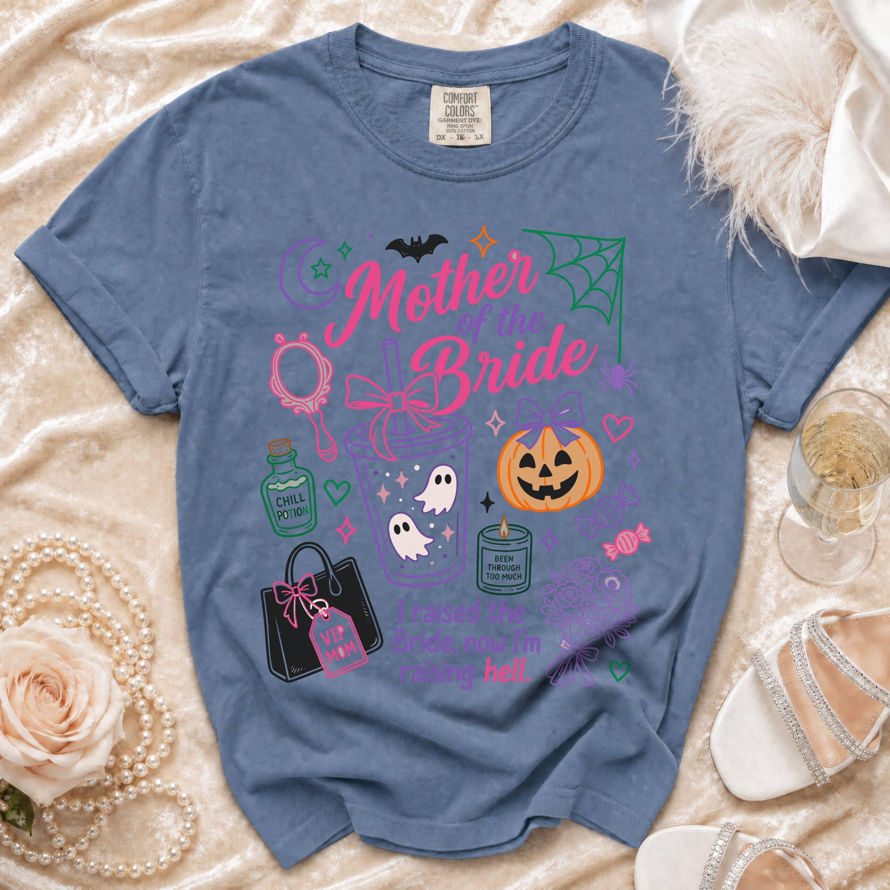 Blue t-shirt with "Mother of the Bride" and Halloween graphics.