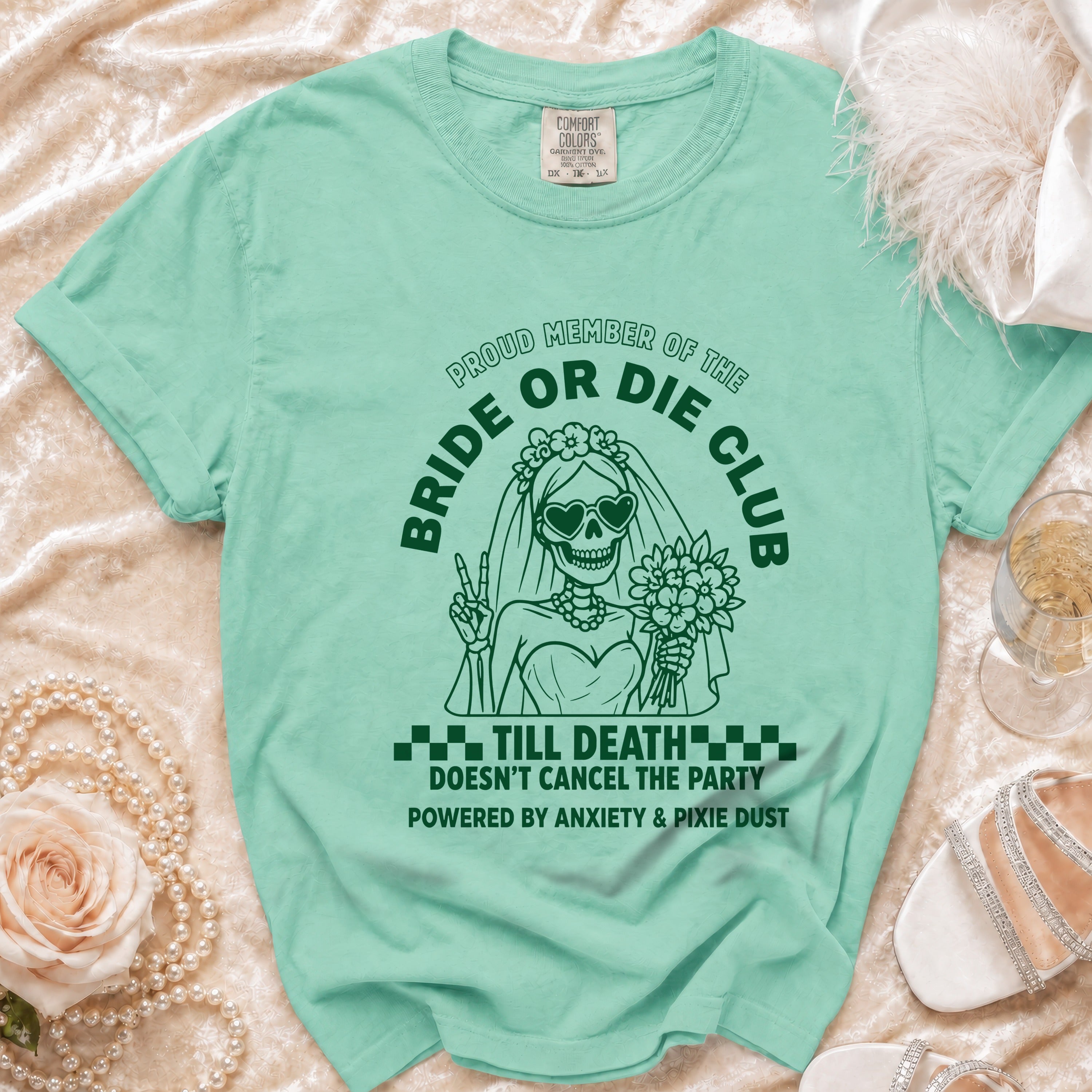 Mint t-shirt with a skeleton bride graphic and text "Proud Member of the Bride or Die Club".
