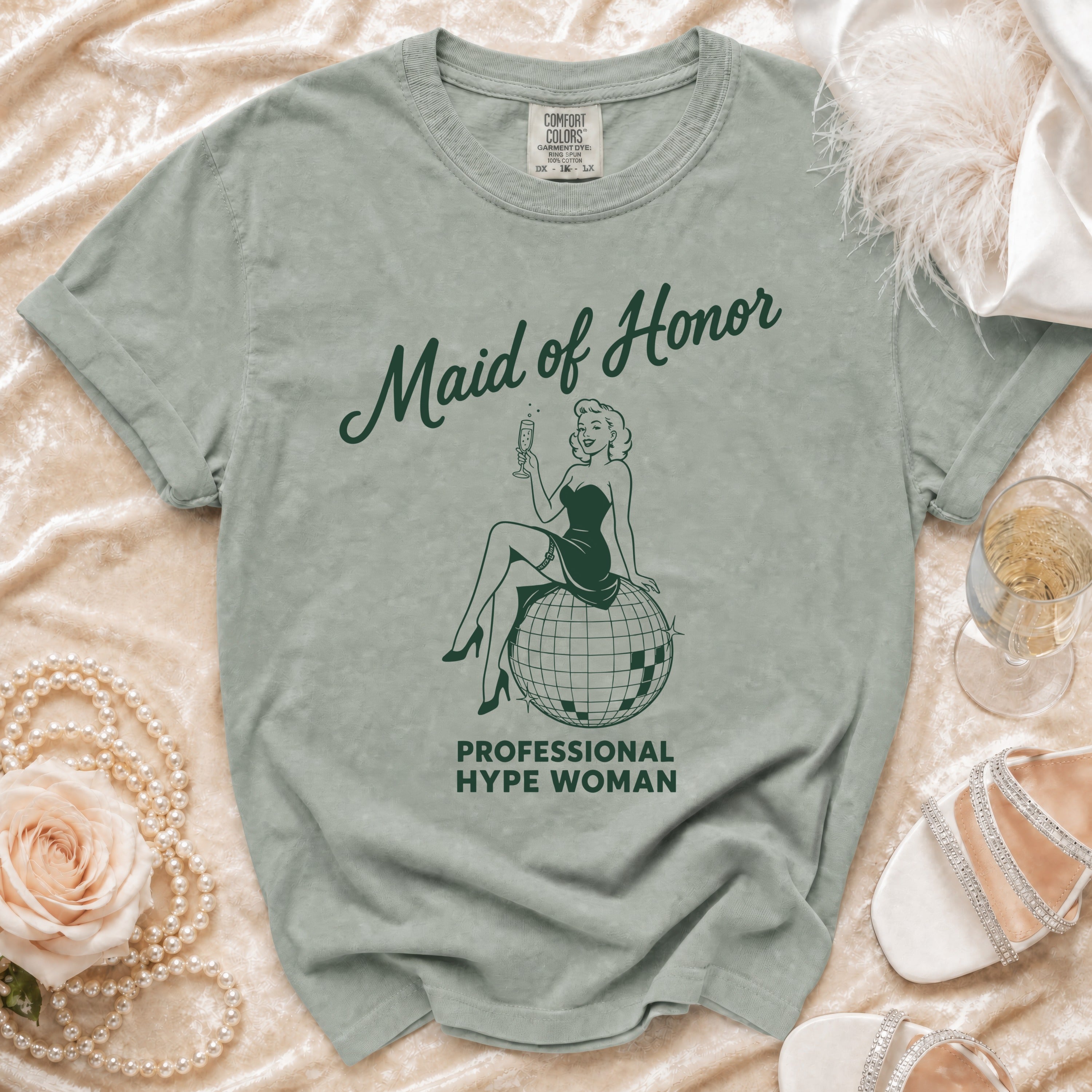 T-shirt with "Maid of Honor Professional Hype Woman" and retro illustration.