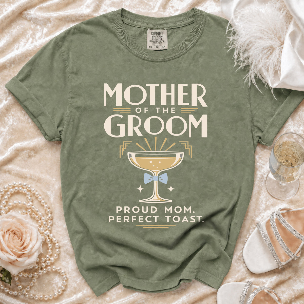 Green t-shirt with "Mother of the Groom" text and champagne glass graphic.