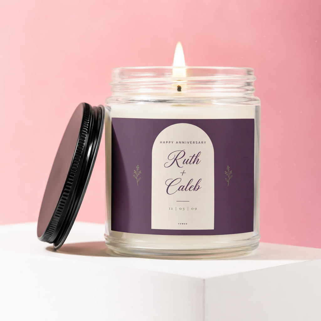 Glass anniversary candle with "Ruth + Caleb 11 | 03 | 09" on the label.