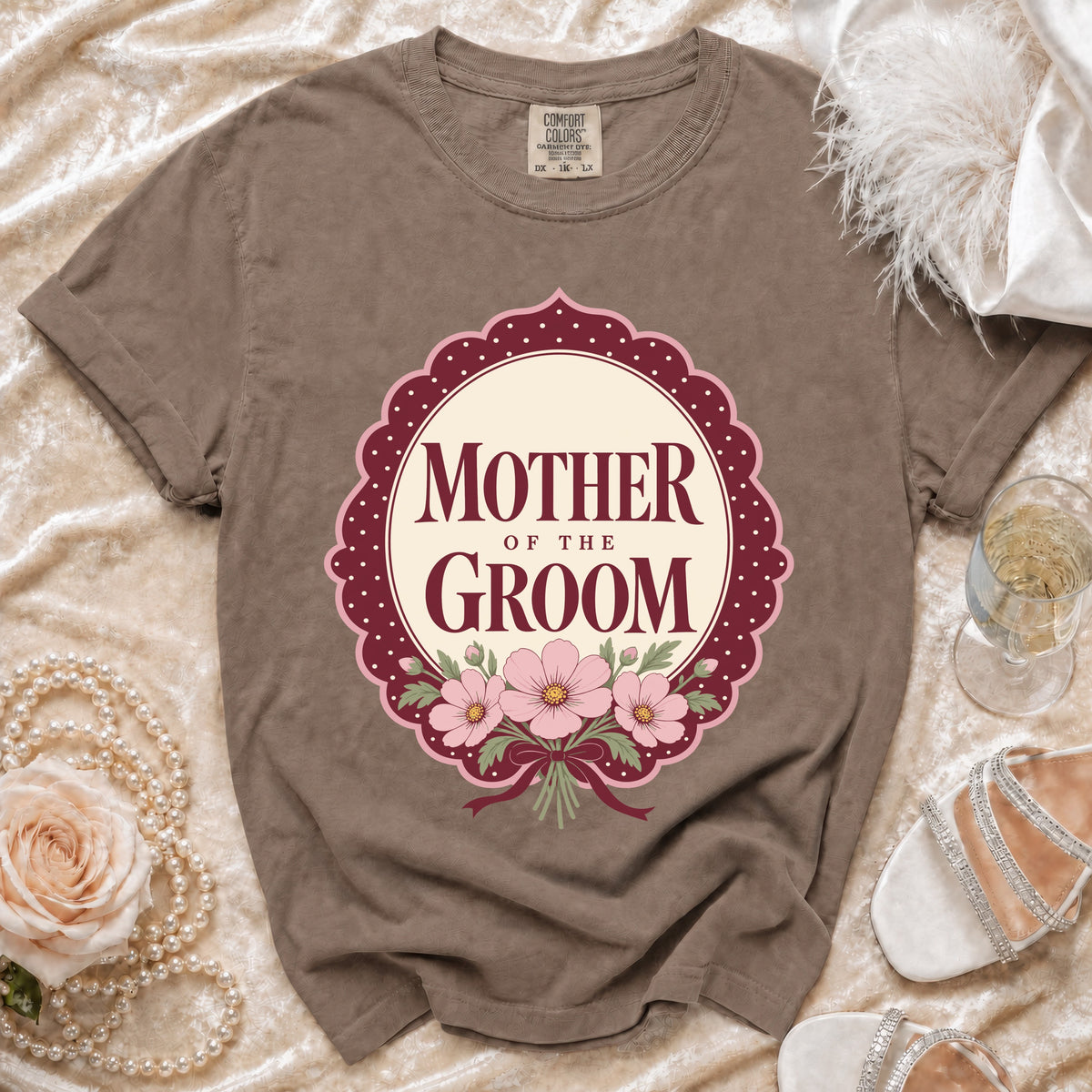 Brown t-shirt with "Mother of the Groom" text and floral design.