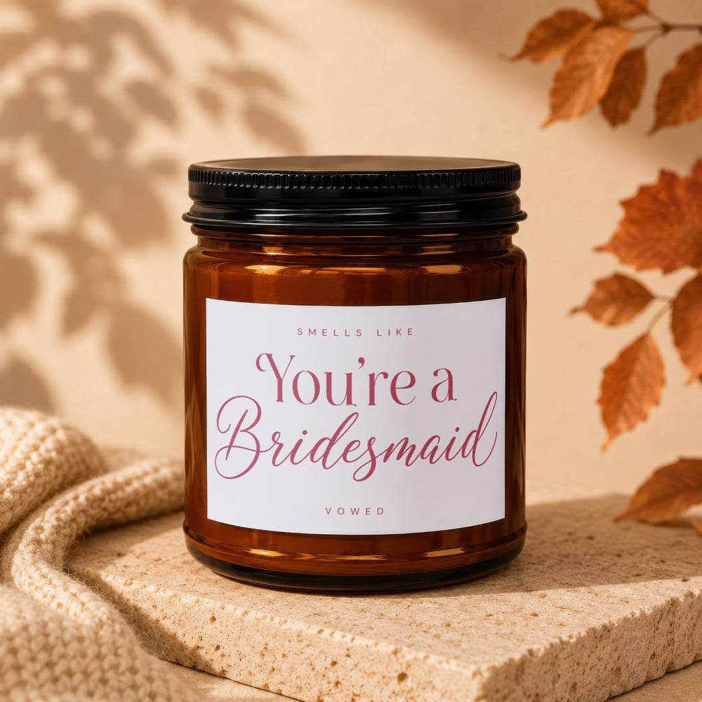 Scented candle with text "Smells Like You're a Bridesmaid" and the word "VOWED".