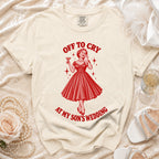 Cream t-shirt with red graphic of a woman crying at her son's wedding.