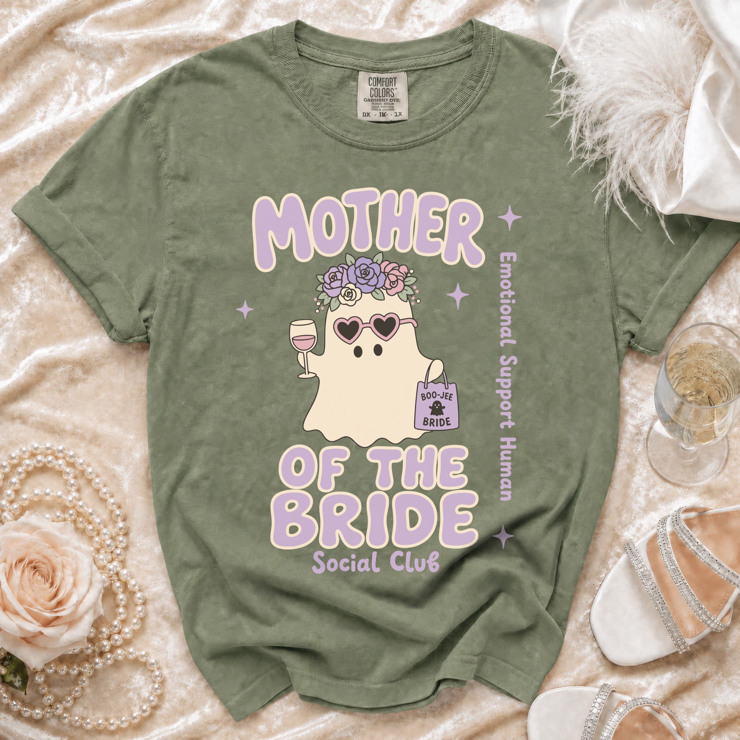 Green t-shirt with "Mother of the Bride Social Club" text and a ghost graphic.