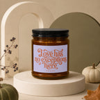 Glass jar candle with label "Love has no exceptions here VOWED."