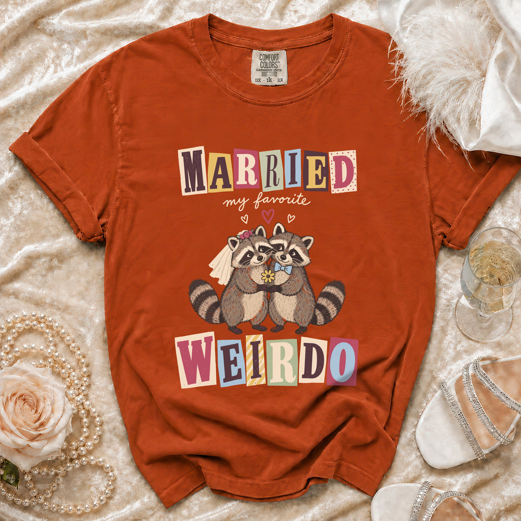 Orange t-shirt with raccoons saying "Married my favorite weirdo" and wedding details.