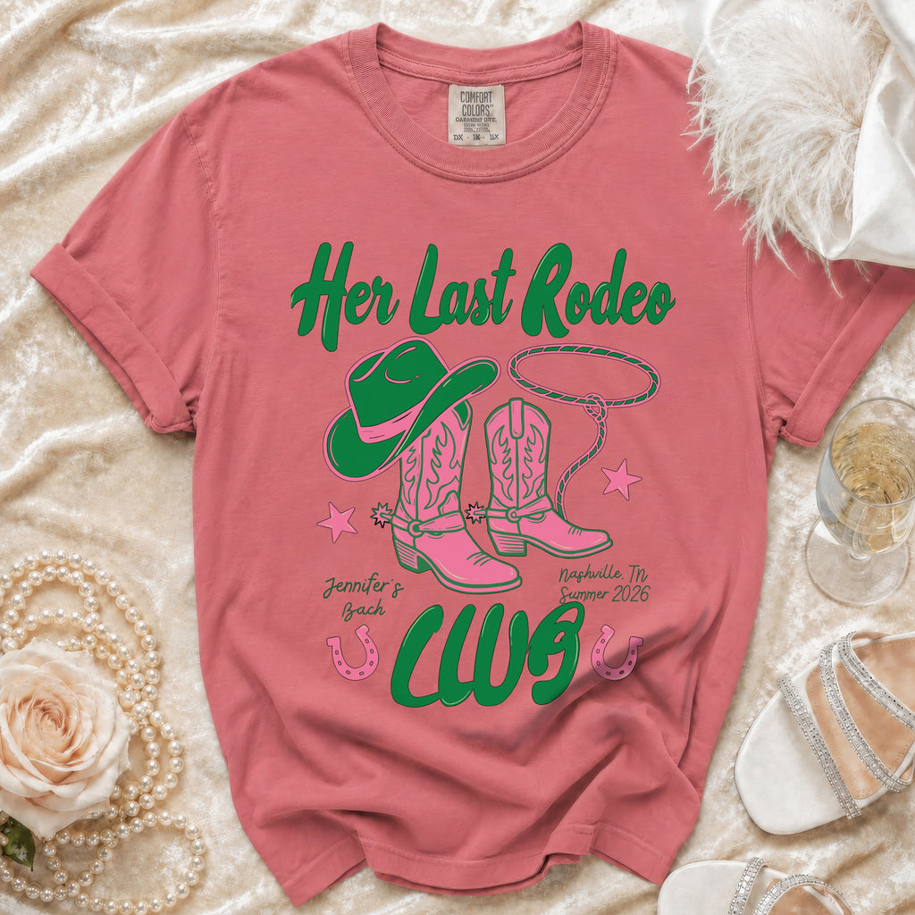 Pink cowboy boots and hat with rope on a t-shirt that says "Her Last Rodeo".