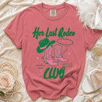 Pink cowboy boots and hat with rope on a t-shirt that says "Her Last Rodeo".