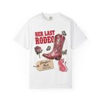White t-shirt with "Her Last Rodeo" and cowboy boot design.