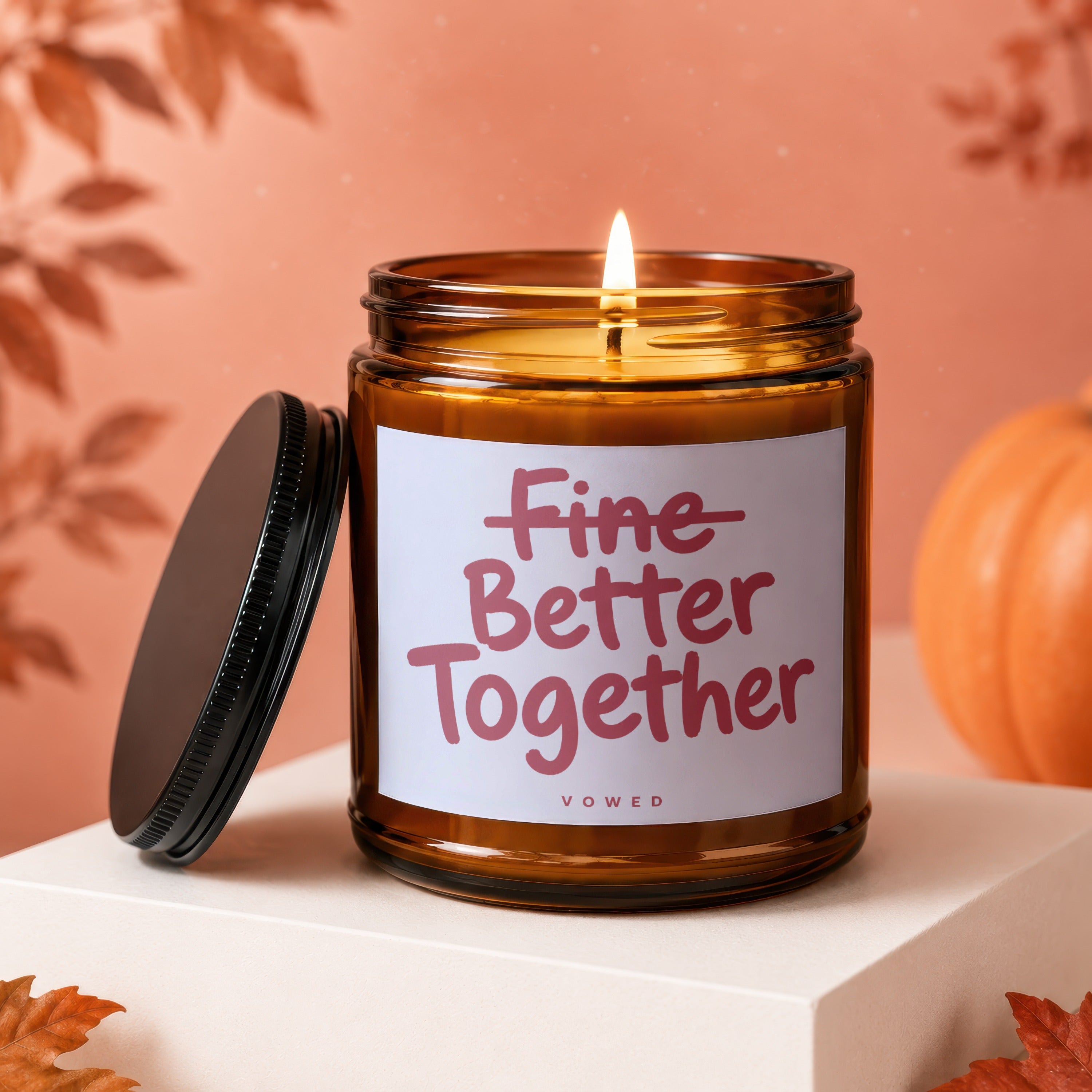 Amber glass candle with "Fine Better Together" text and "VOWED" label.