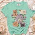 Mint green shirt with "Mother of the Bride" and Halloween-themed stamps.