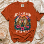 T-shirt with "Just Married Still Wild" text and two leopards in wedding attire.