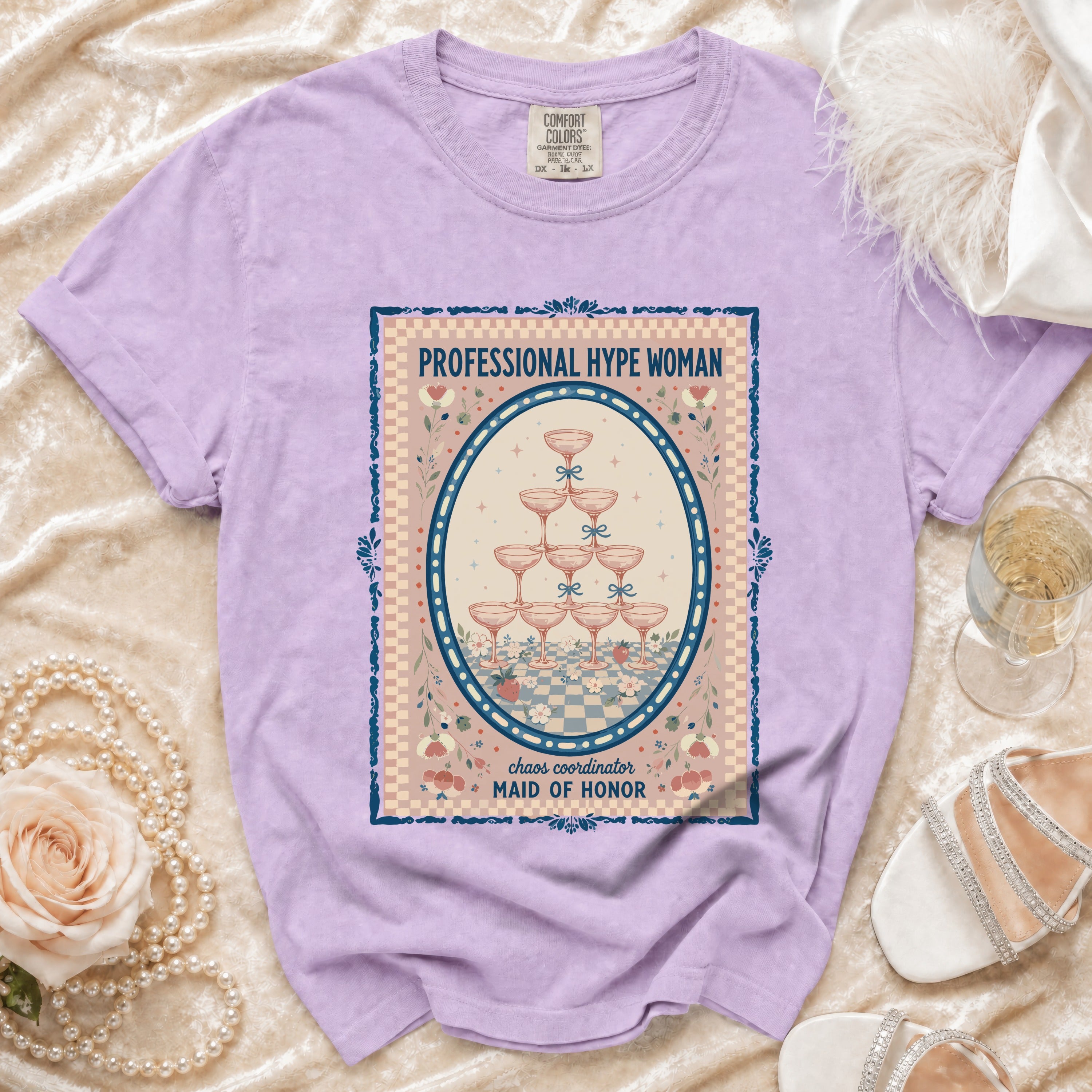Lavender t-shirt with "Professional Hype Woman" and champagne glasses graphic.