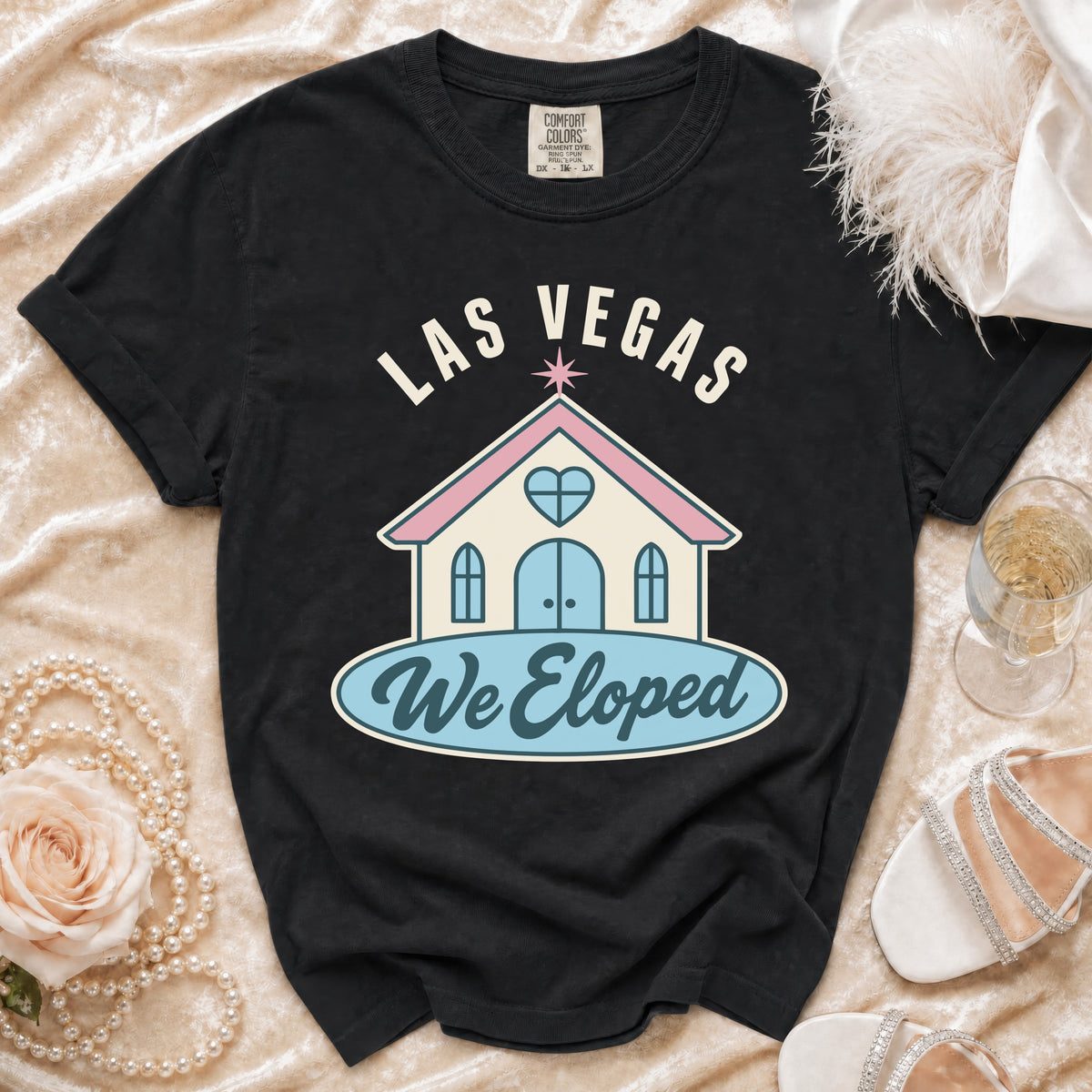 Black t-shirt with "LAS VEGAS We Eloped" graphic of a chapel.