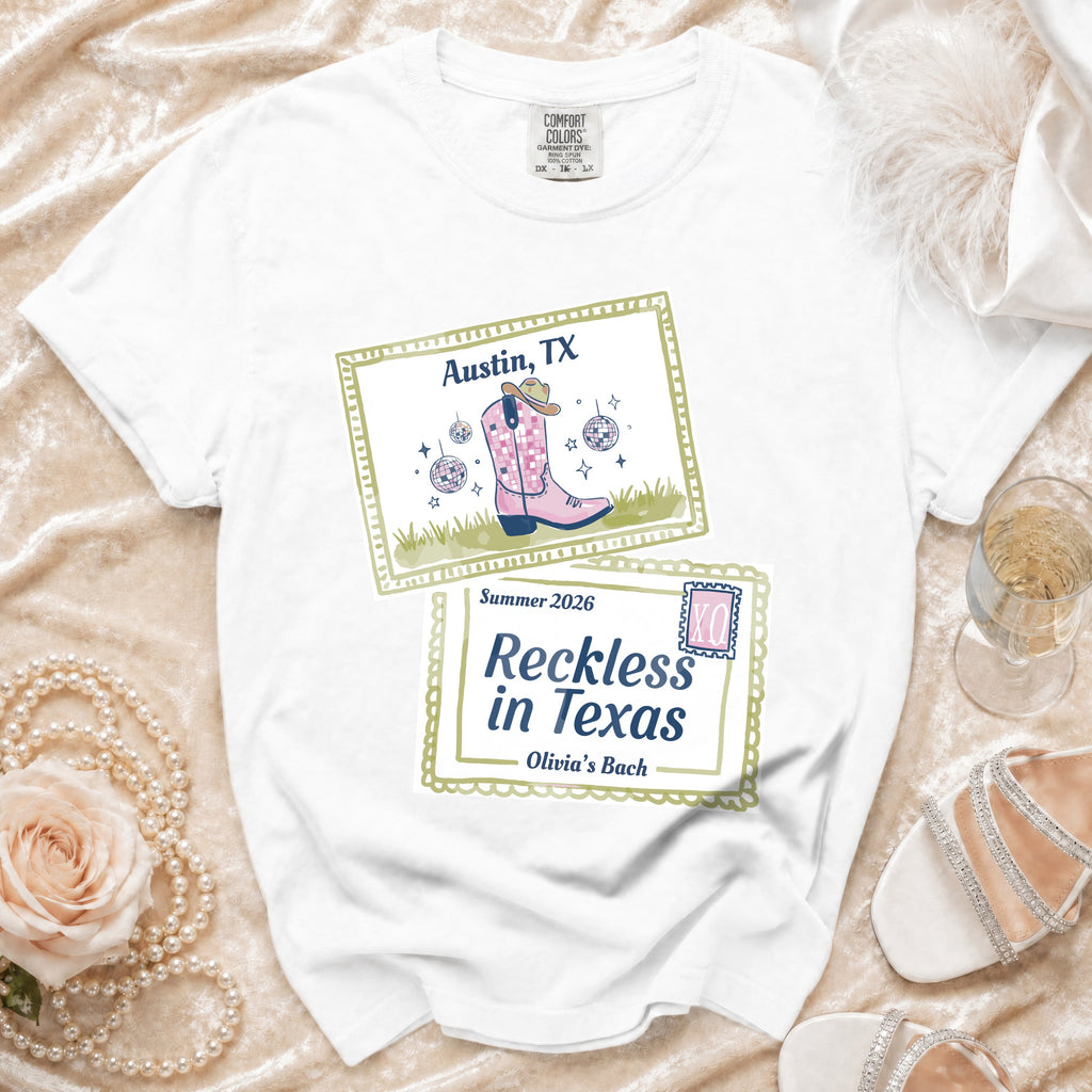 White t-shirt with "Austin, TX Summer 2026 Reckless in Texas Olivia's Bach" text and graphic.