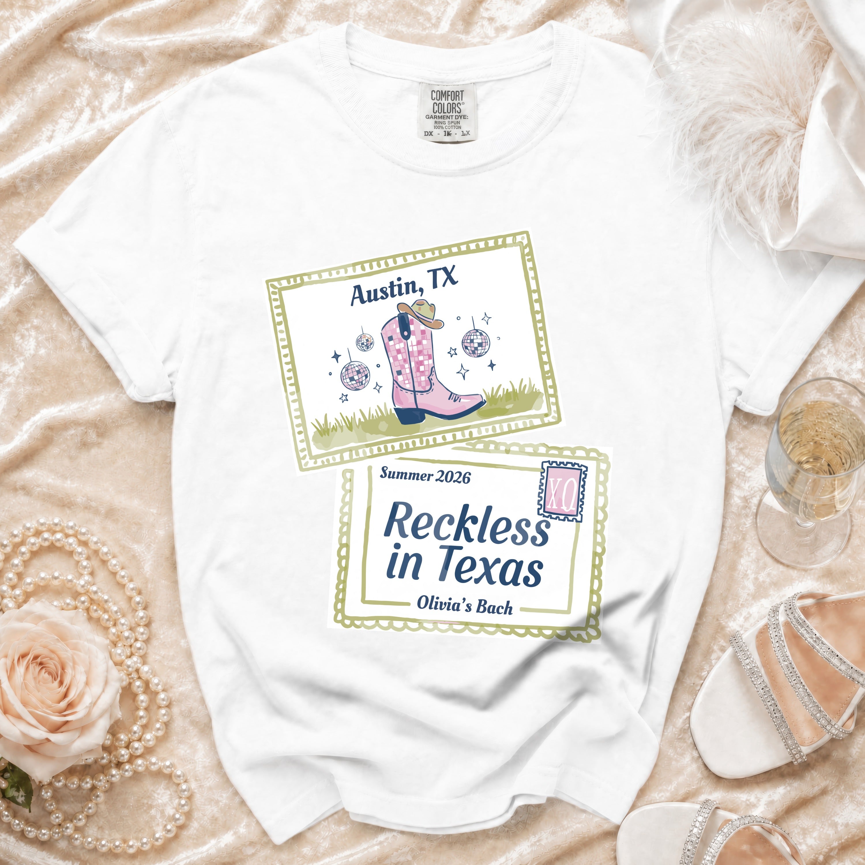 White t-shirt with "Austin, TX Summer 2026 Reckless in Texas Olivia's Bach" text and graphic.