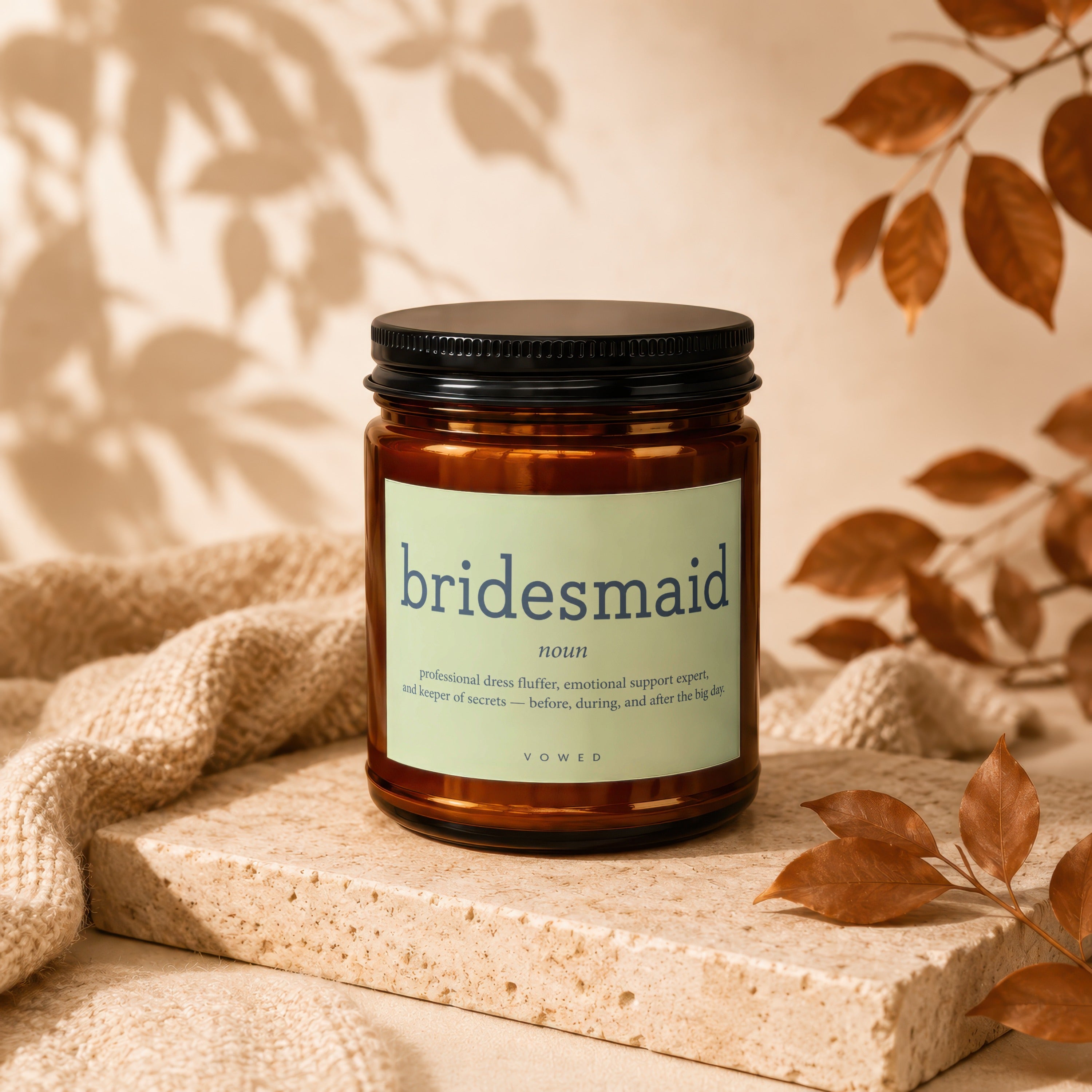 Brown glass candle with "bridesmaid" definition label and a black lid.
