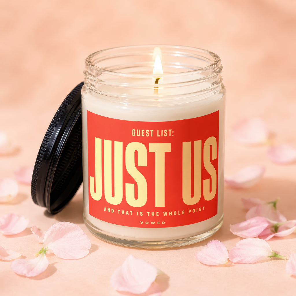 Jar candle with red label reading "GUEST LIST: JUST US AND THAT IS THE WHOLE POINT VOWED"