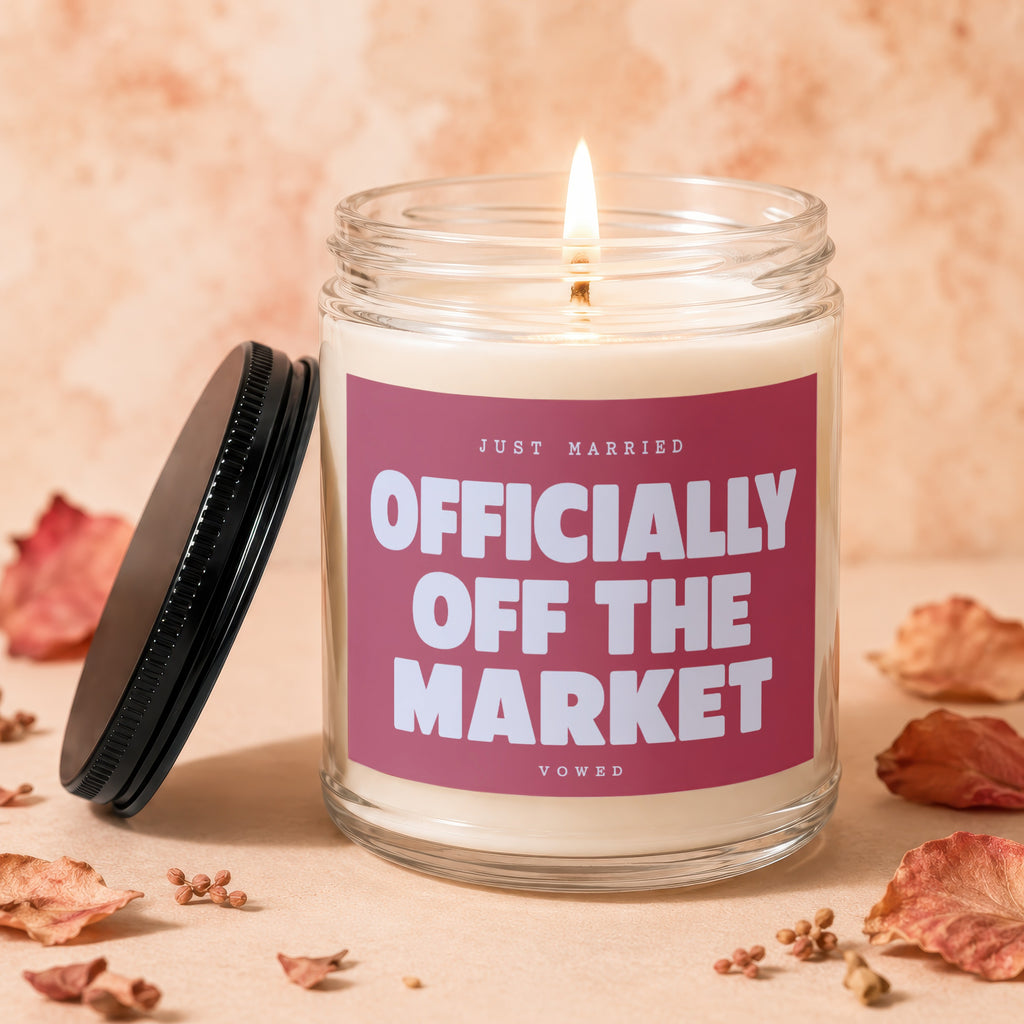 Glass candle with pink label reading "Just Married Officially Off The Market Vowed".