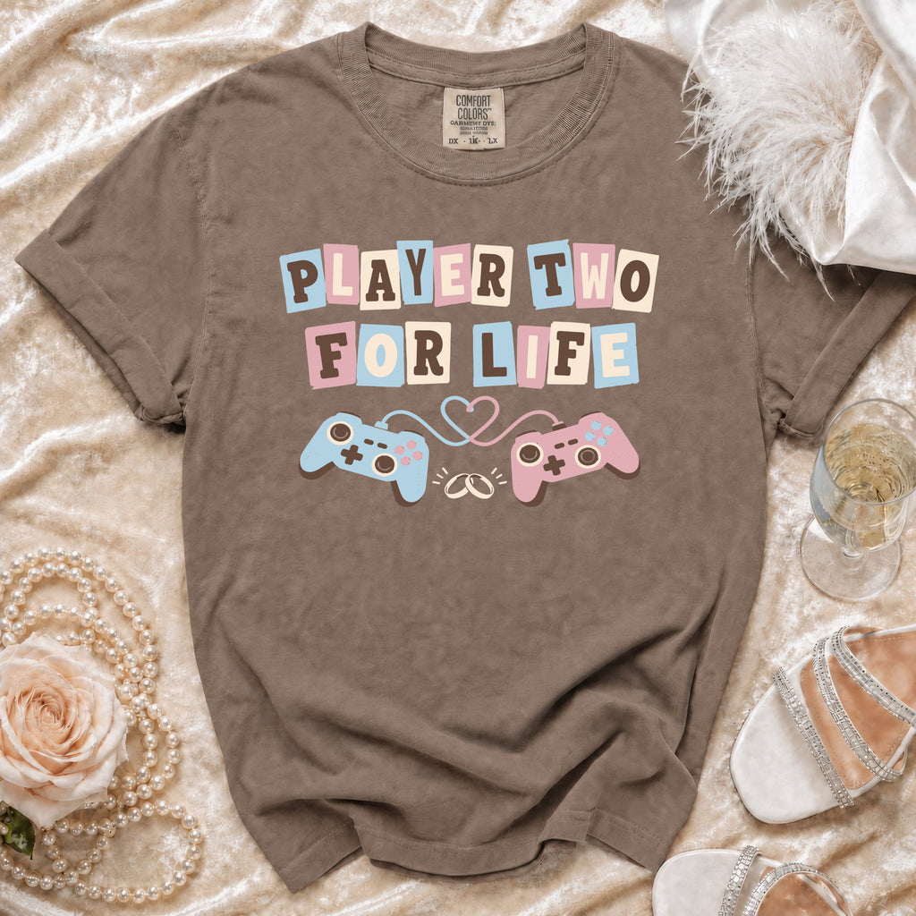 Brown t-shirt with "PLAYER TWO FOR LIFE" text and gaming controllers.