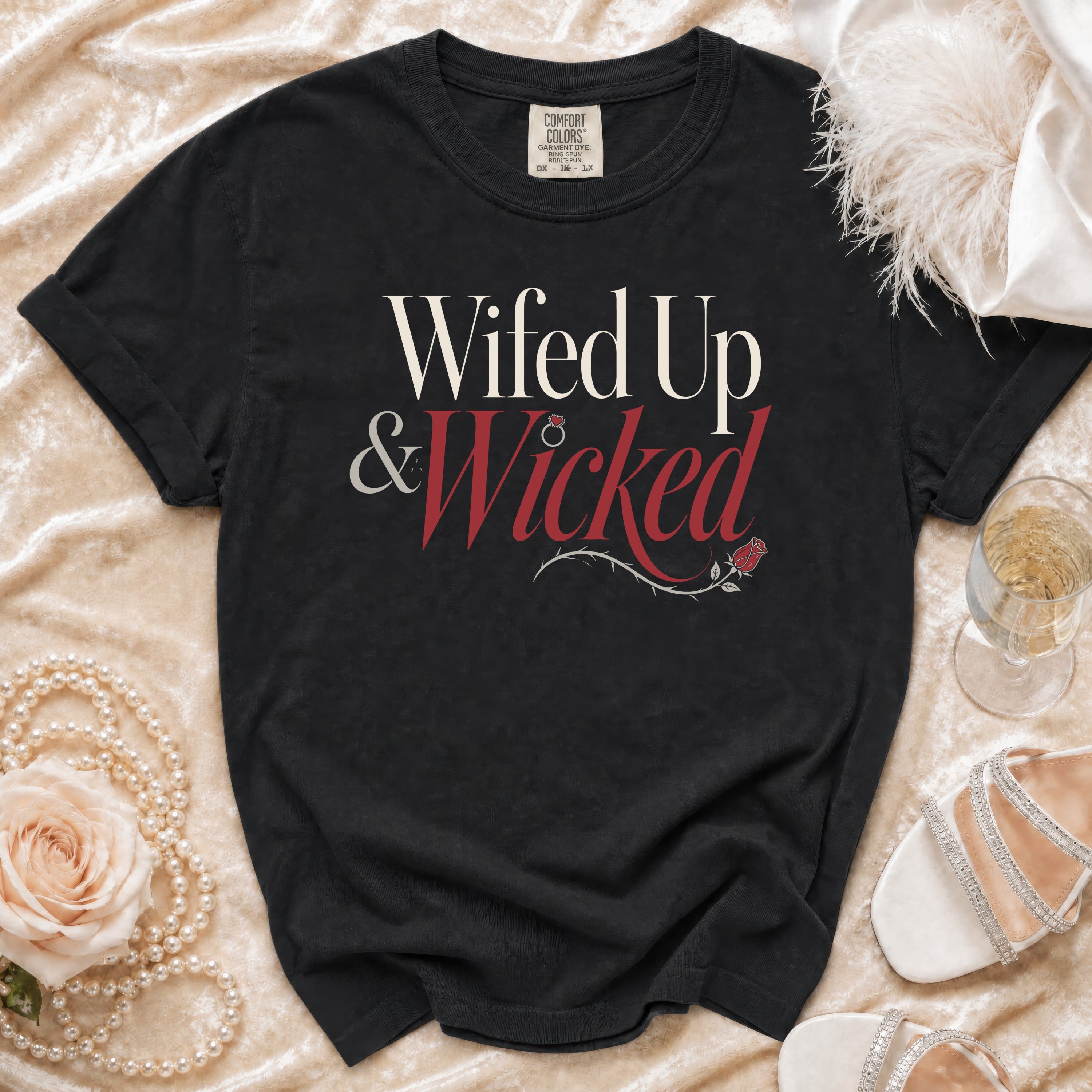 Black t-shirt with "Wifed Up & Wicked" text and rose detail.