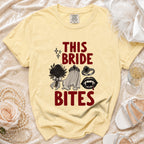 Yellow t-shirt with "THIS BRIDE BITES" text and vampire-themed graphics.