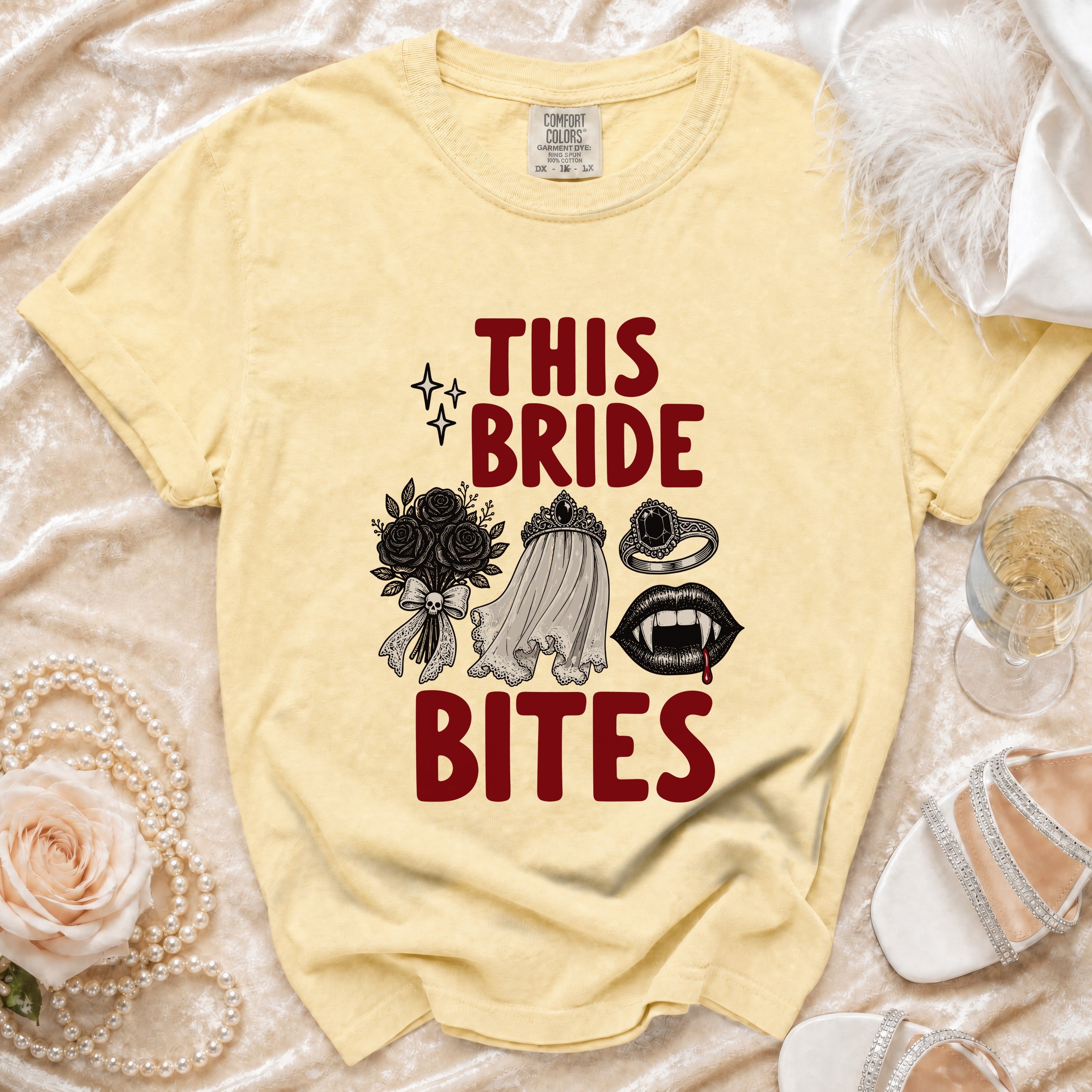 Yellow t-shirt with "THIS BRIDE BITES" text and vampire-themed graphics.